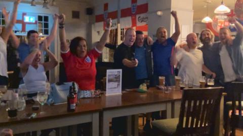 York pubgoers celebrate an England goal together