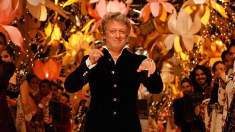 Indian fashion designer Rohit Bal walks on the ramp during the Indian Bridal Fashion Week 2013 held at The Grand on July 26, 2013 in New Delhi, India. 