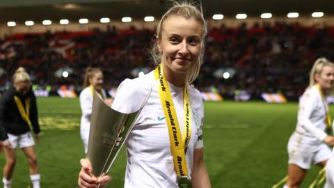 Leah Williamson with the Arnold Clark Cup trophy