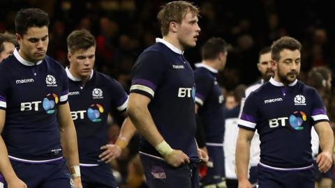 Scotland players look dejected after their defeat by Wales