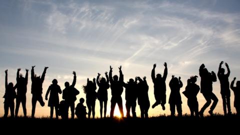 A line of people jumping