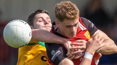 Donegal's Brendan McCole challenges Pat Havern in Sunday's quarter-final