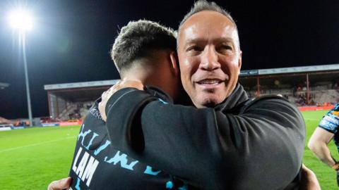 Adrian and Lachlan Lam embrace after Leigh's first win of the season