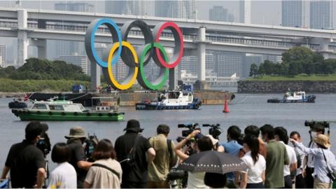 Olympic rings being moved