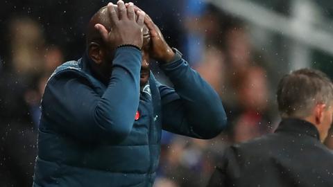 Darren Moore places his hands on his head after Ipswich draw with Huddersfield