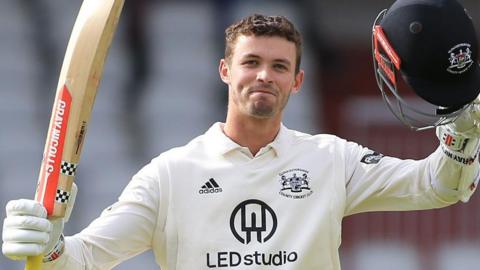Ollie Price celebrates scoring 200