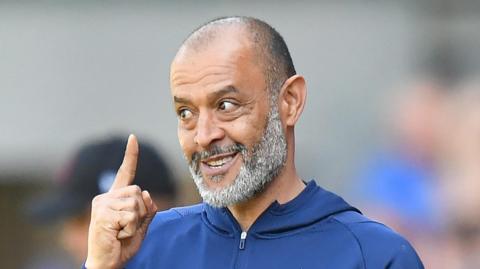 Nuno Espirito Santo, the Nottingham Forest manager, holds up one finger on his right hand and smiles