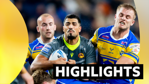 Catalans' Fouad Yahais tackled by Leeds' Cooper Jenkins and Morgan Gannon
