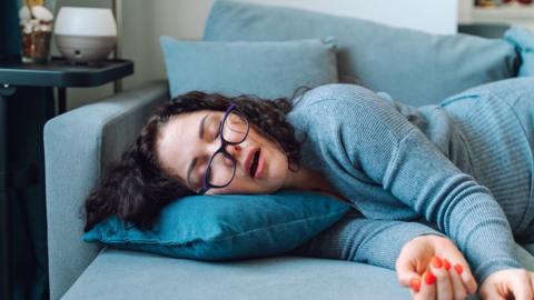 Woman sleep at home on a sofa - stock photo