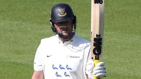 Ollie Robinson celebrates scoring fifty