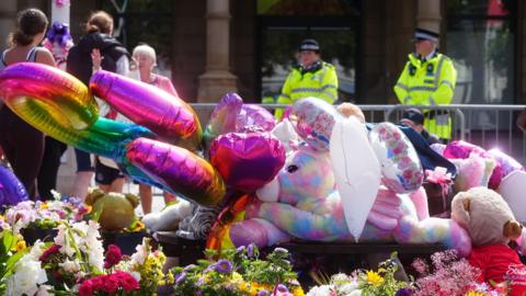 Colourful balloons, soft toys and flowers are left in tribute to the victims of the 29 July 2024 Southport knife attack