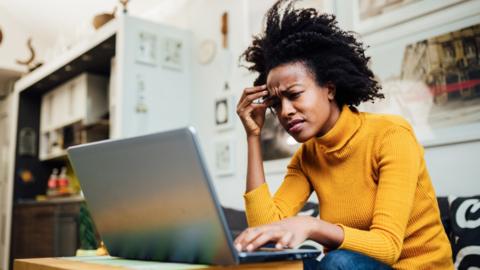 Stressed lady at a computer