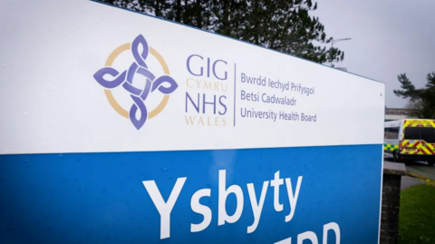 A hospital sign displaying the Betsi Cadwaladr health board logo