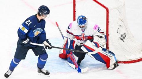 GB goaltender Mat Robson repels a Finnish attack