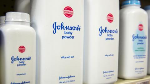 Bottles of Johnson's baby powder on a supermarket shelf