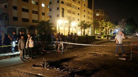 Palestinians check the scene following an explosion in Gaza City August 27, 2019.