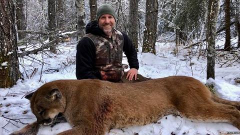Steve Ecklund with cougar