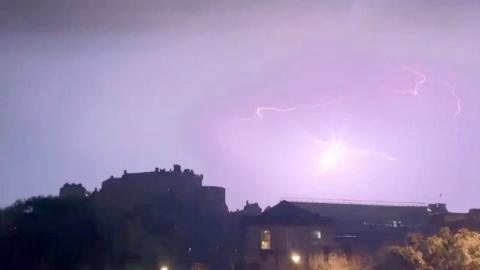 Lightning flashes over Edinburgh Castle