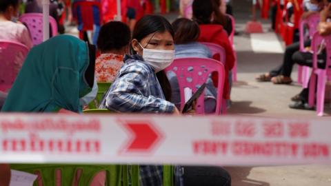 People wait to get tested inside a red zone with strict lockdown measures during the latest outbreak of the coronavirus disease (COVID-19) in Phnom Penh, Cambodia