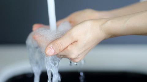 Woman washing hands