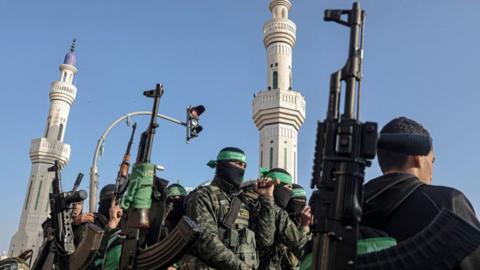 Members of the Ezzedine al-Qassam Brigades, the armed wing of the Palestinian Hamas movement, attend the funeral of their comrade Mohammed Abed during his funeral in Rafah in the southern Gaza Strip on February 16, 2022.