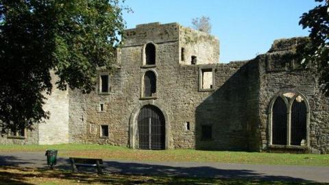 A general view of the entrance to Workington Hall. There hare bars on the doors and windows and the building is a castle ruin.