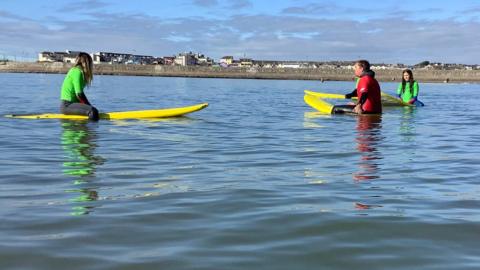 Children paddleboarding