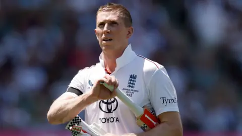 England opener Zak Crawley walks off after being dismissed