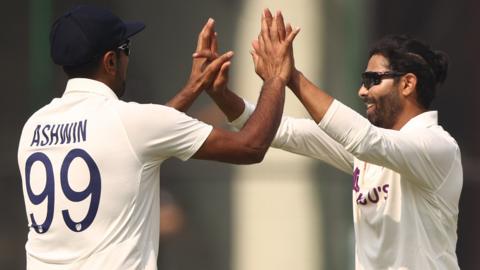 Ravindra Jadeja of India celebrates with Ravichandran Ashwin after taking the wicket of Usman Khawaja of Australia during day one of the Second Test match in the series between India and Australia at Arun Jaitley Stadium