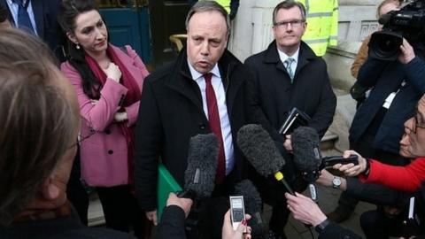 Nigel Dodds and other DUP MPs speak to the media after talks with UK ministers in central London