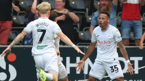 Swansea City's Ronald (right) celebrates goal
