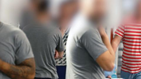 Male prisoners in a UK jail, their faces blurred to protect identities