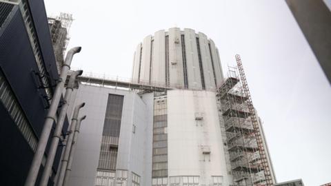 A view from the ground looking up at the tower of the Dungeness B nuclear power station