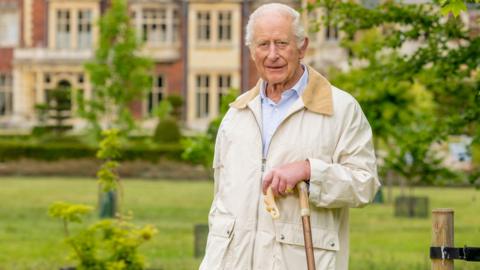 King Charles with a shepherd's crook at Sandringham in Norfolk