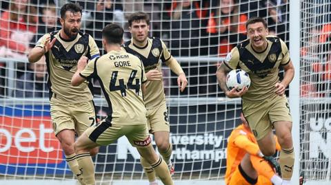 Rotherham players celebrate Joe Rafferty's goal against Northampton
