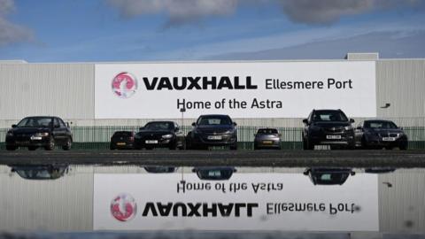 Vauxhall cars parked in front of Ellesmere Port plant.