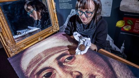 Dr Hannah Thomas with portrait of Mary Ward and her C17th Paternoster bead.