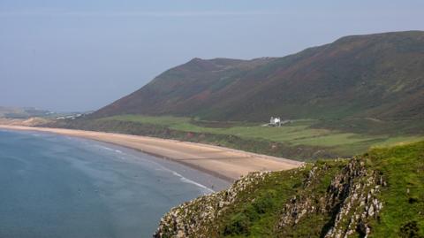 A general view of Rhossili Bay beach on the Gower in Rhossili, Wales. 