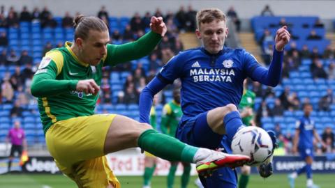 Brad Potts of Preston North End clears as Alfie Doughty of Cardiff City challenges