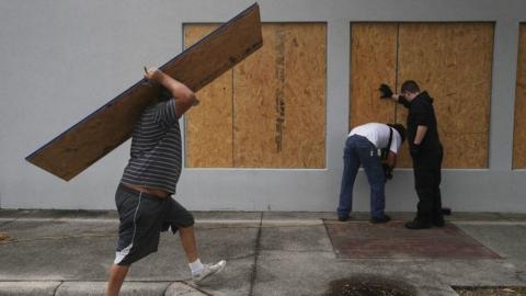 Residents put plywood up in Port St Joe, Florida