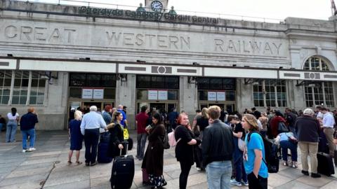 Passengers outside the station