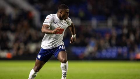 Thierry Small plays for Preston North End in their white home kit against Birmingham City in April