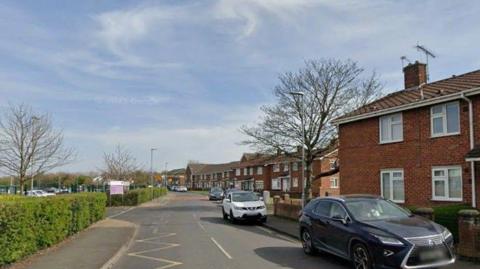 Google Maps image of Talbot Street. It has several red brick houses with cars parked alongside.