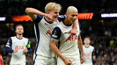 Richarlison of Tottenham Hotspur celebrates scoring his team's first goal from a penalty kick with teammate Lucas Bergvall