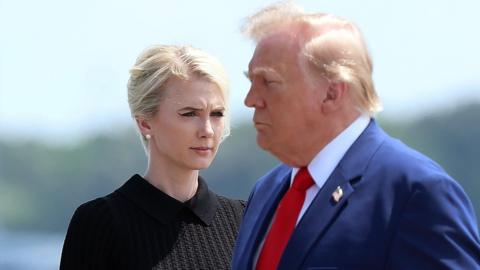 Natalie Harp, executive assistant to US President Donald Trump, stands as President Trump arrives for a dignified transfer.