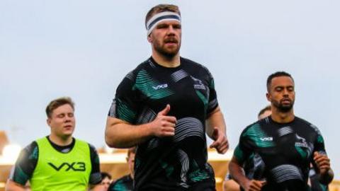 Callum Chick of Newcastle Falcons leads his players out for the warm-up