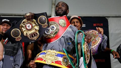 Terence Crawford with his belts