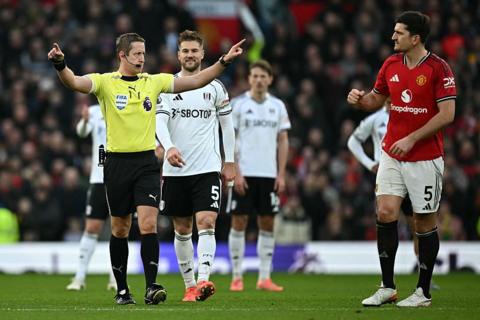 Referee John Brooks indicated that a Fulham goal has been ruled out for offside after a VAR check