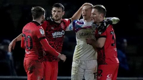 Huddersfield celebrate at full-time after beating Wycombe 1-0