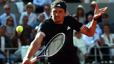 Alexander Zverev hits a backhand